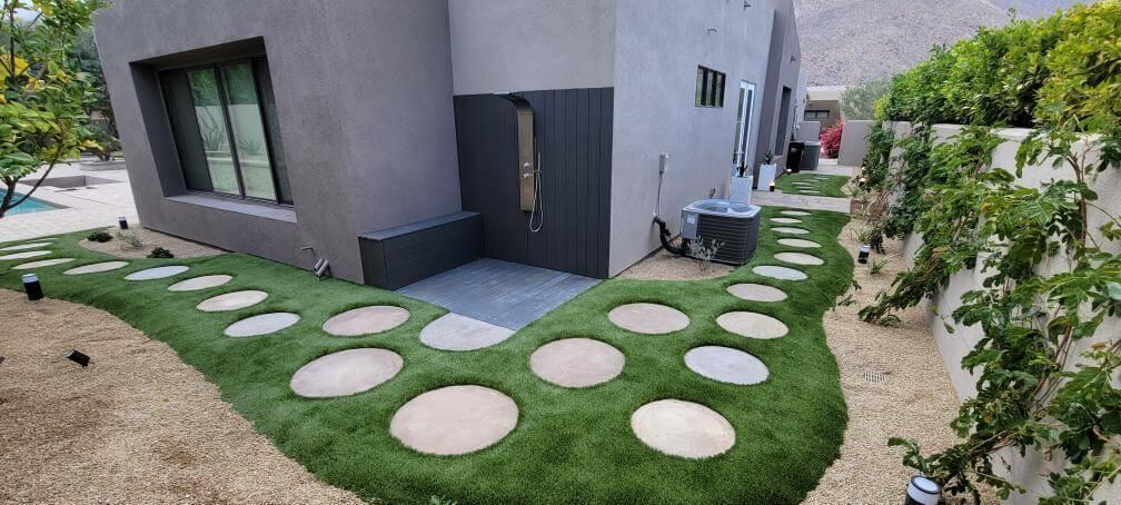 Walkway with artificial grass and stones